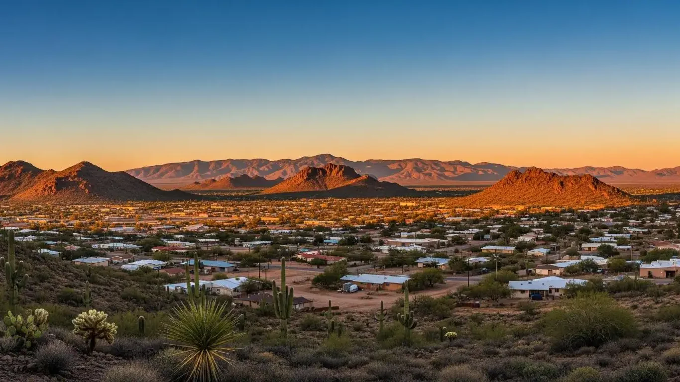 A desert landscape in northwestern Arizona under a wide sky, with sparse vegetation and distant mountains, suggesting a quiet and settled life.